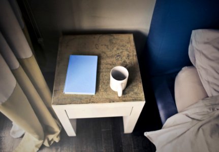 Photography Of Side Table Near Bed