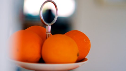 Selective Focus Photography Of Orange Fruits On White Plate