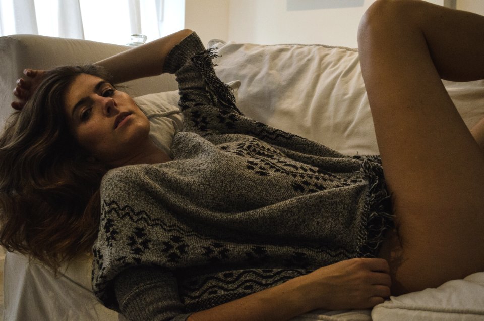 Photography Of A Woman Lying On Couch