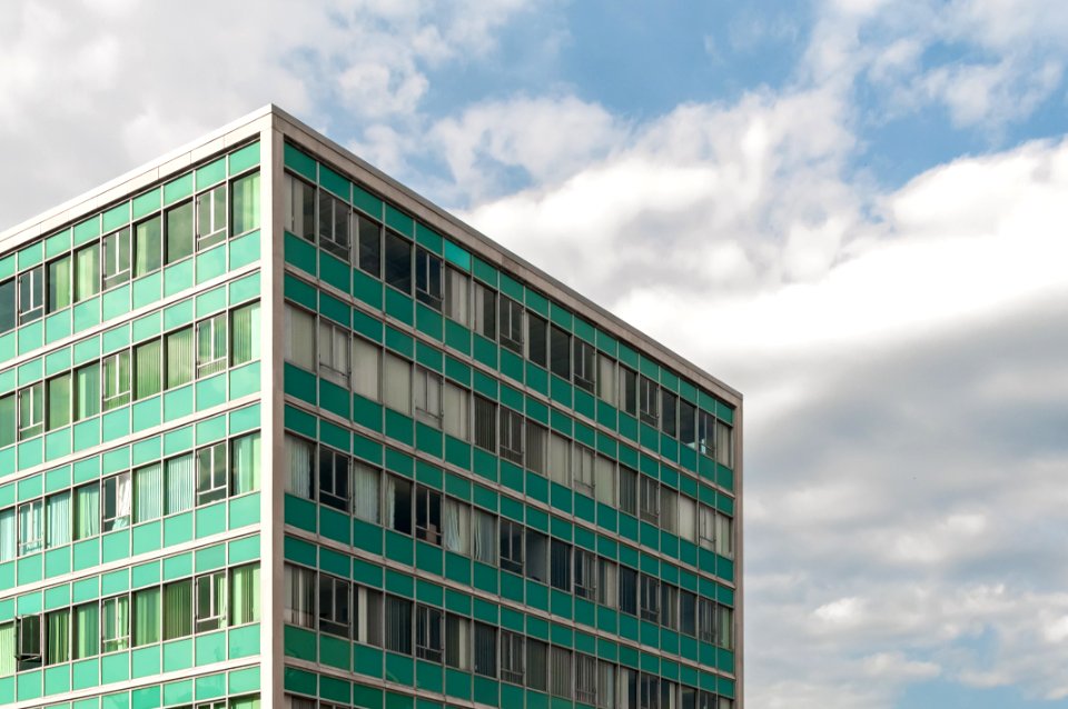 Photography Of Building Under Cloudy Sky