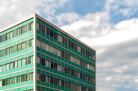 Photography Of Building Under Cloudy Sky