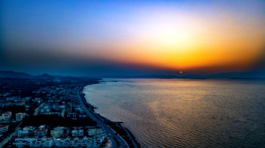 Birds Eye View Of City Near Ocean During Dawn photo