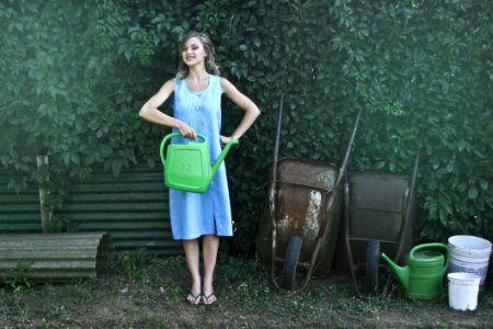 Photo Of Woman Holding Watering Can photo