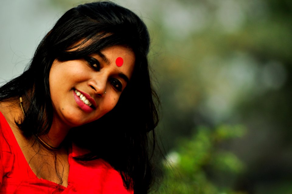 Close-Up Photography Of A Smiling Girl photo