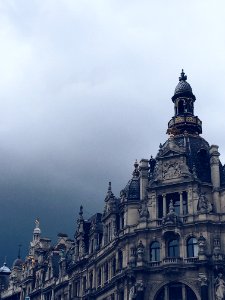 Beige Concrete Building And White Clouds photo