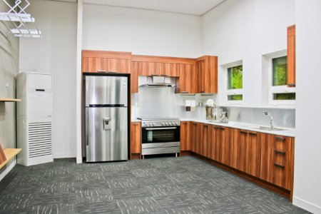 Stainless Steel Top-mount Refrigerator On Gray Carpet photo