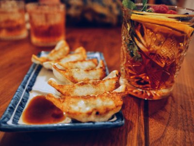 Cooked Breads Platter Beside Drink photo