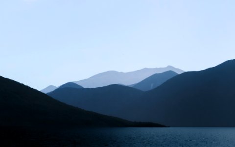 Photo Of Mountains Near Body Of Water photo