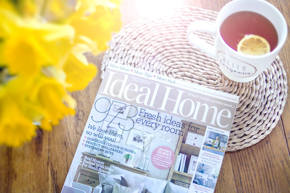Photo Of Magazine Near Cup Of Tea