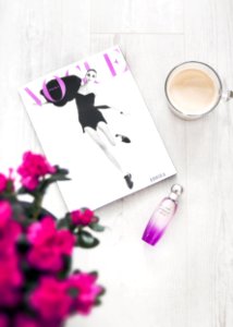Vogue Magazine Beside Perfume Bottle