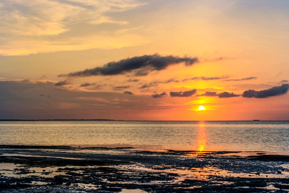 Body Of Water During Sunset