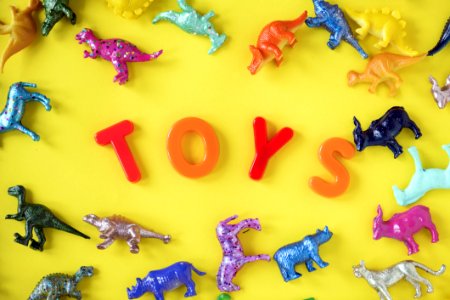 Assorted Plastic Toy On Yellow Surface photo