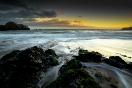Rocks On Seashore During Golden Hour photo