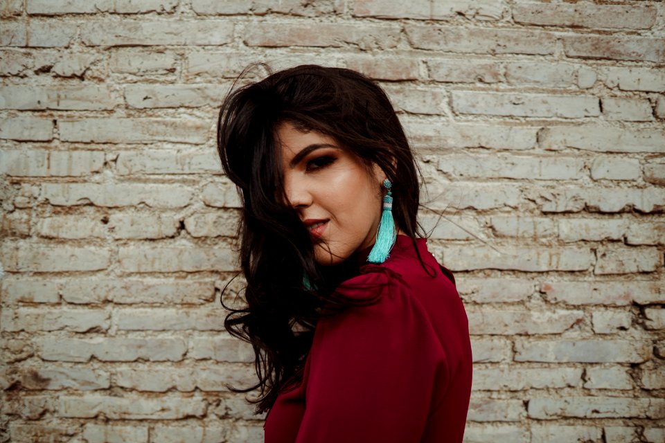 Woman Wearing Teal Tassel Earring