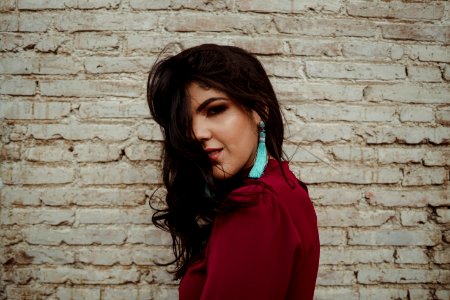Woman Wearing Teal Tassel Earring