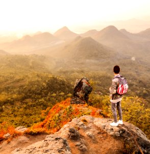 Man Standing On A Mountain Summit photo