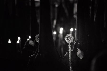 Grayscale Photo Of Person Wearing Balaclava Holding Wand