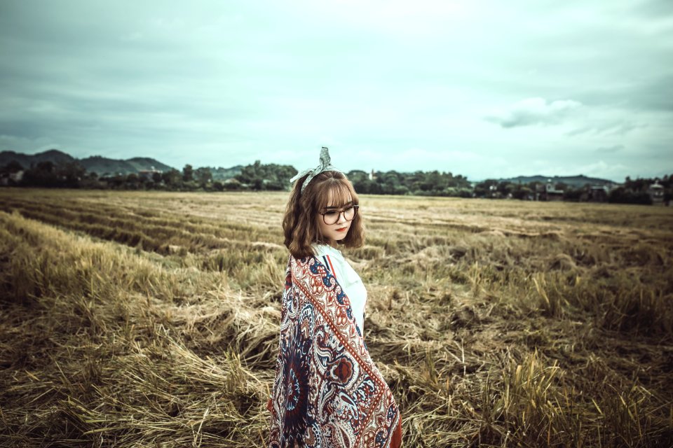 Woman In Brown And Black Floral Scarf