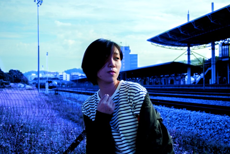 Lady In White Pinstripe Scoop-neck Shirt And Black Jacket