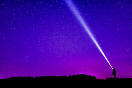 Silhouette Of Person Under Blue And Purple Sky photo