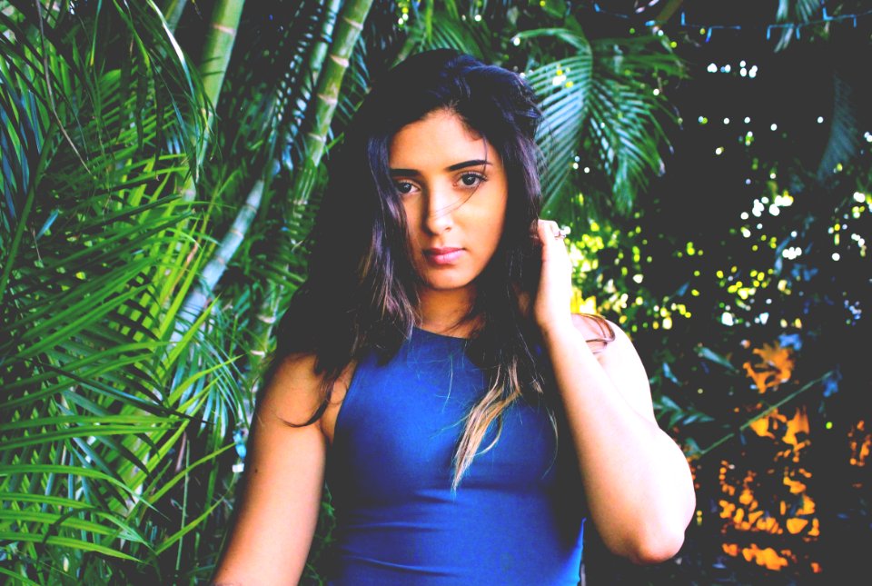 Photo Of Woman In Blue Sleeveless Top
