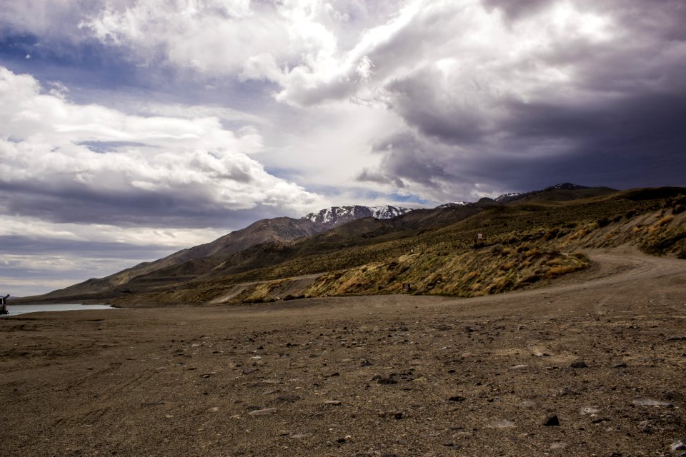 Photography Of Mountains Under Cloudy Sky