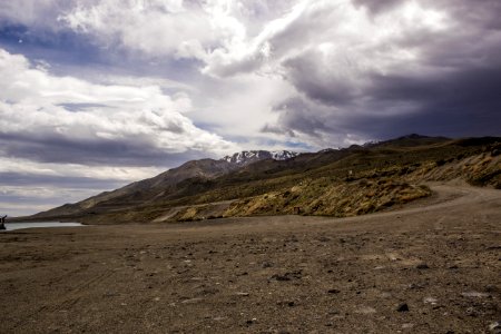 Photography Of Mountains Under Cloudy Sky