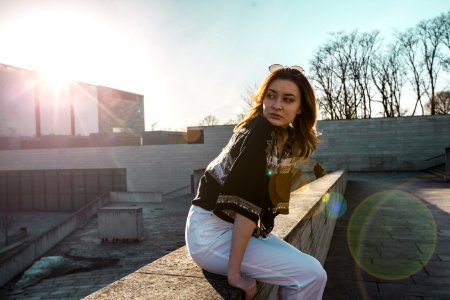 Woman In Black Top And White Pants photo