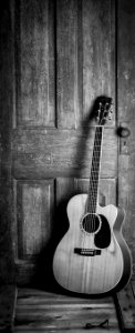 Brown And Black Cut-away Acoustic Guitar photo