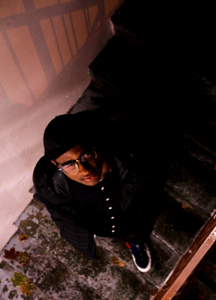 Man Wearing Black Jacket Looking Upward