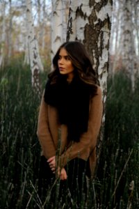 Woman Leaning On Tree