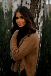 Woman Wearing Brown Knit Sweater photo