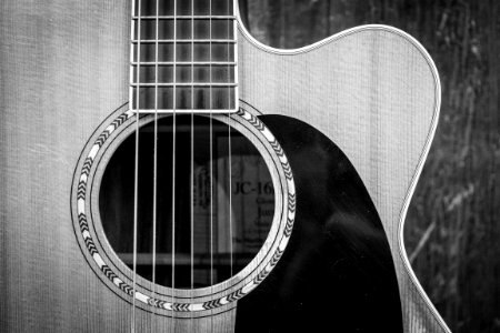 Grayscale Photo Of Cutaway Acoustic Guitar photo