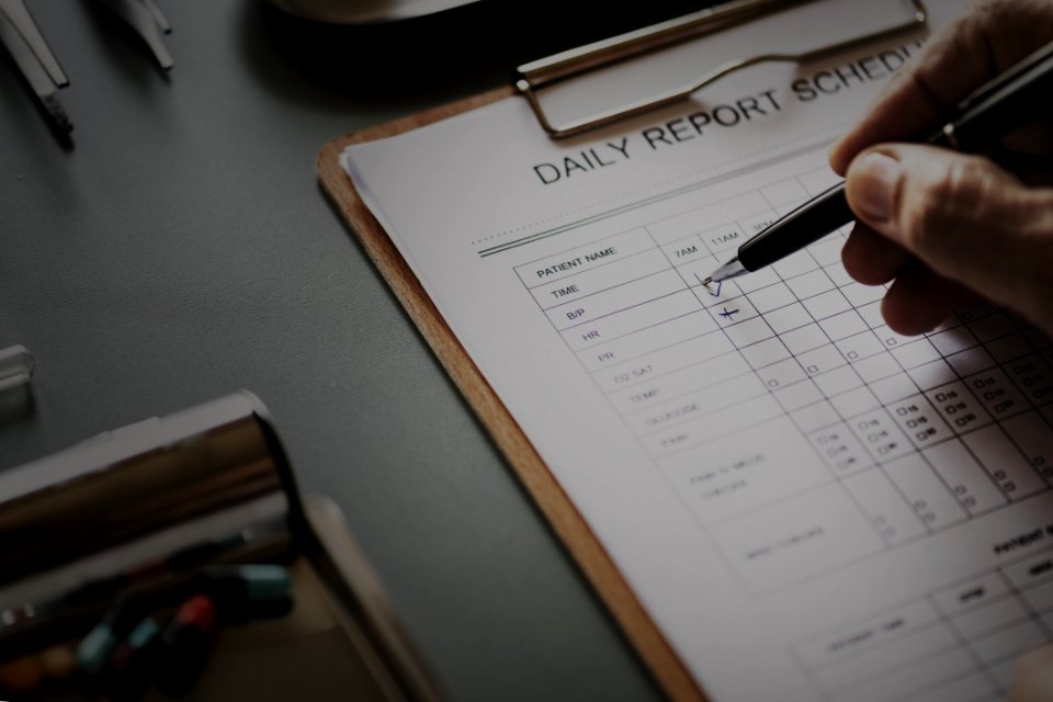 Daily Report Schedule Paper On Brown Clipboard