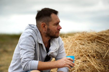 Shallow Focus Photography Of Man In Gray Hoodie photo