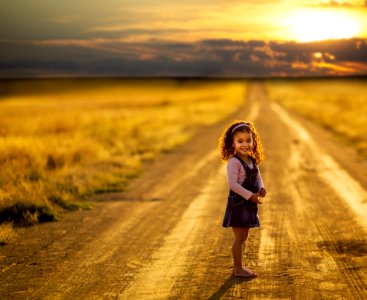 Girl Standing In The Middle Of The Road
