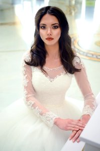 Women In White Long-sleeved Bridal Gown photo