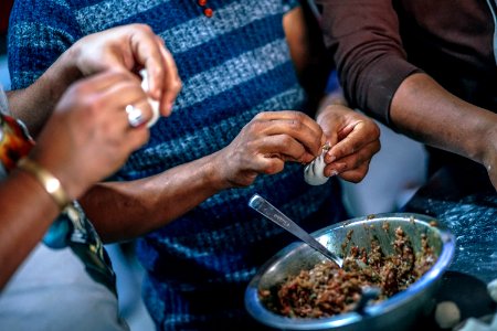 Photo Of People Making Dumplings