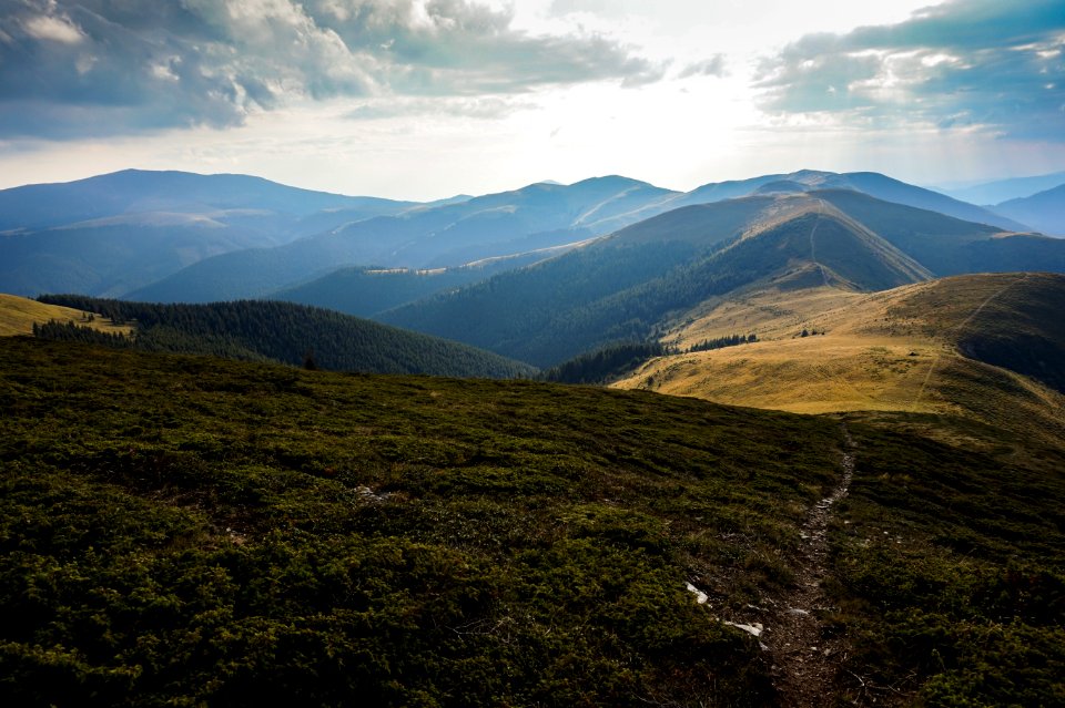 Aerial Photography Of Mountain Under Cloudy Sky photo