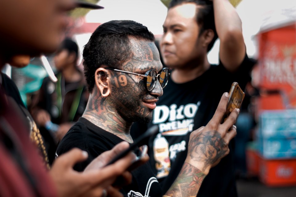 Man With Gray Wash In Full Face Tattoo