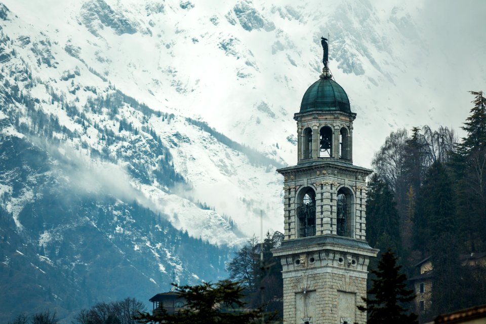 White Concrete Tower Near Mountain photo