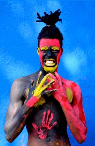 Man Painted With Red And Yellow Paint