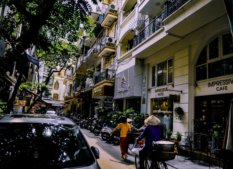 People Walking In Front Of Buildings