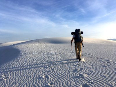 Photo Of Man Holding Hiking Poles On Snow Field