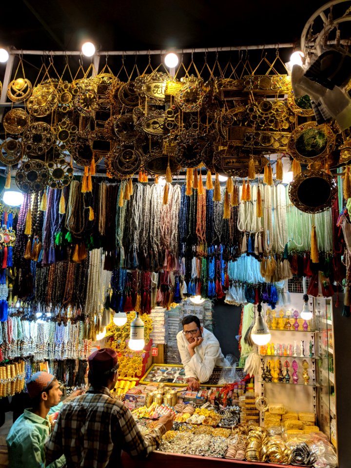 Three Men Surrounded With Jewelries During Nighttime