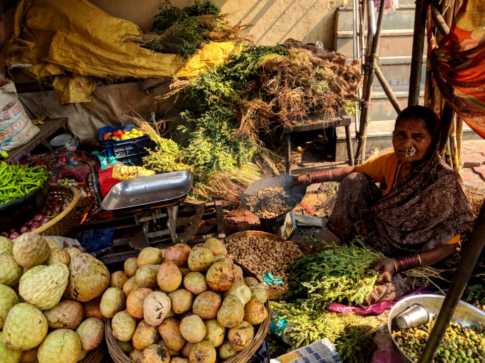 Woman Beside Vegetables On Baskets