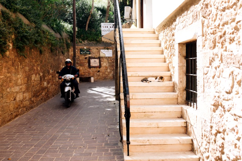Man Riding White Motorcycle