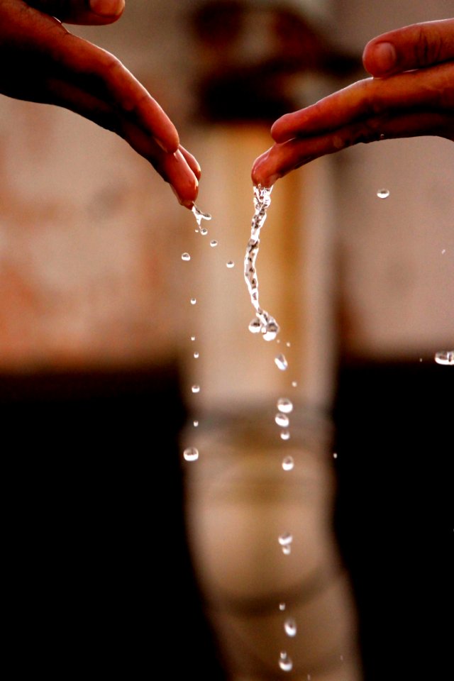Hands With Drops Of Water