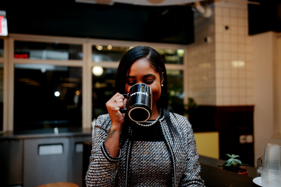 Photo Of Woman Holding Black Mug