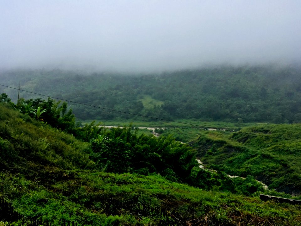 Aerial Photography Of Mountain Under White Clouds Foggy Time